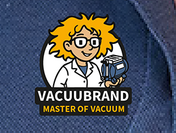 Pin with the inscription 'Master of vacuum' featuring a cheerful cartoon character in a lab coat holding a VACUUBRAND vacuum pump.
